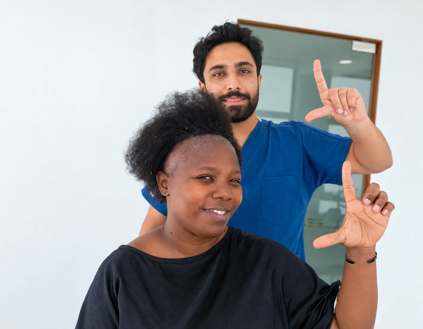 Black woman attending a female hair-loss consultation with a hair restoration specialist