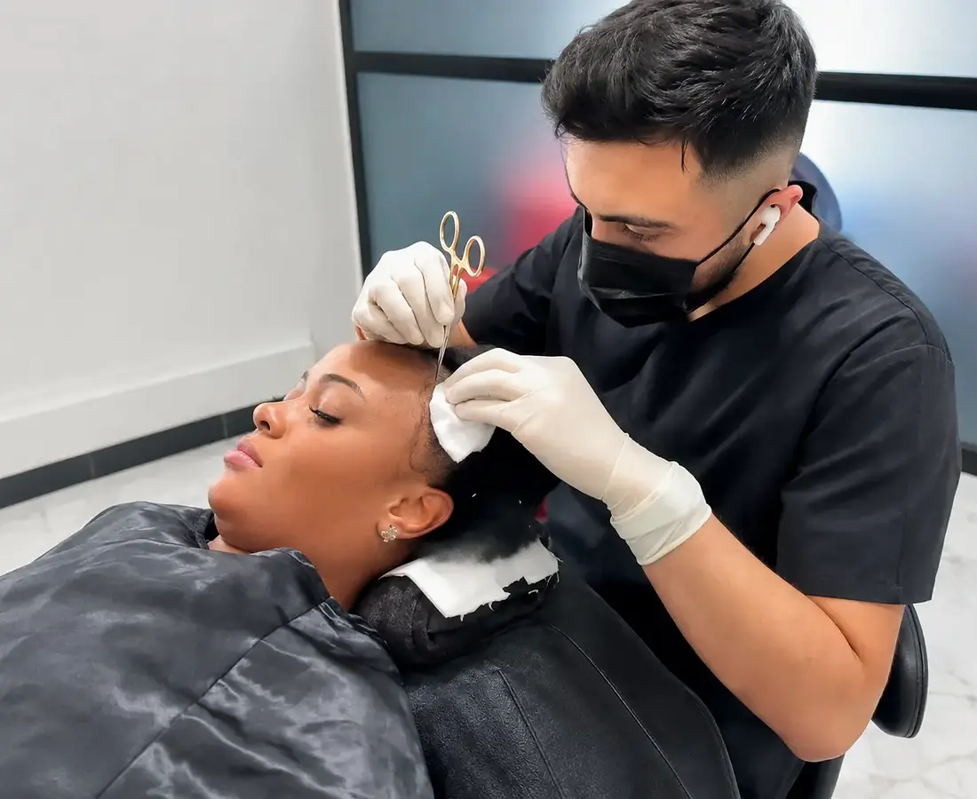 Woman receiving specialist hair restoration care