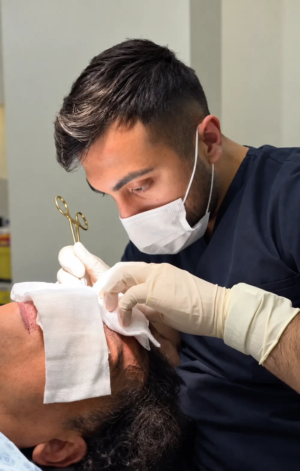 Specialist performing a precise eyebrow transplant procedure in a modern clinic